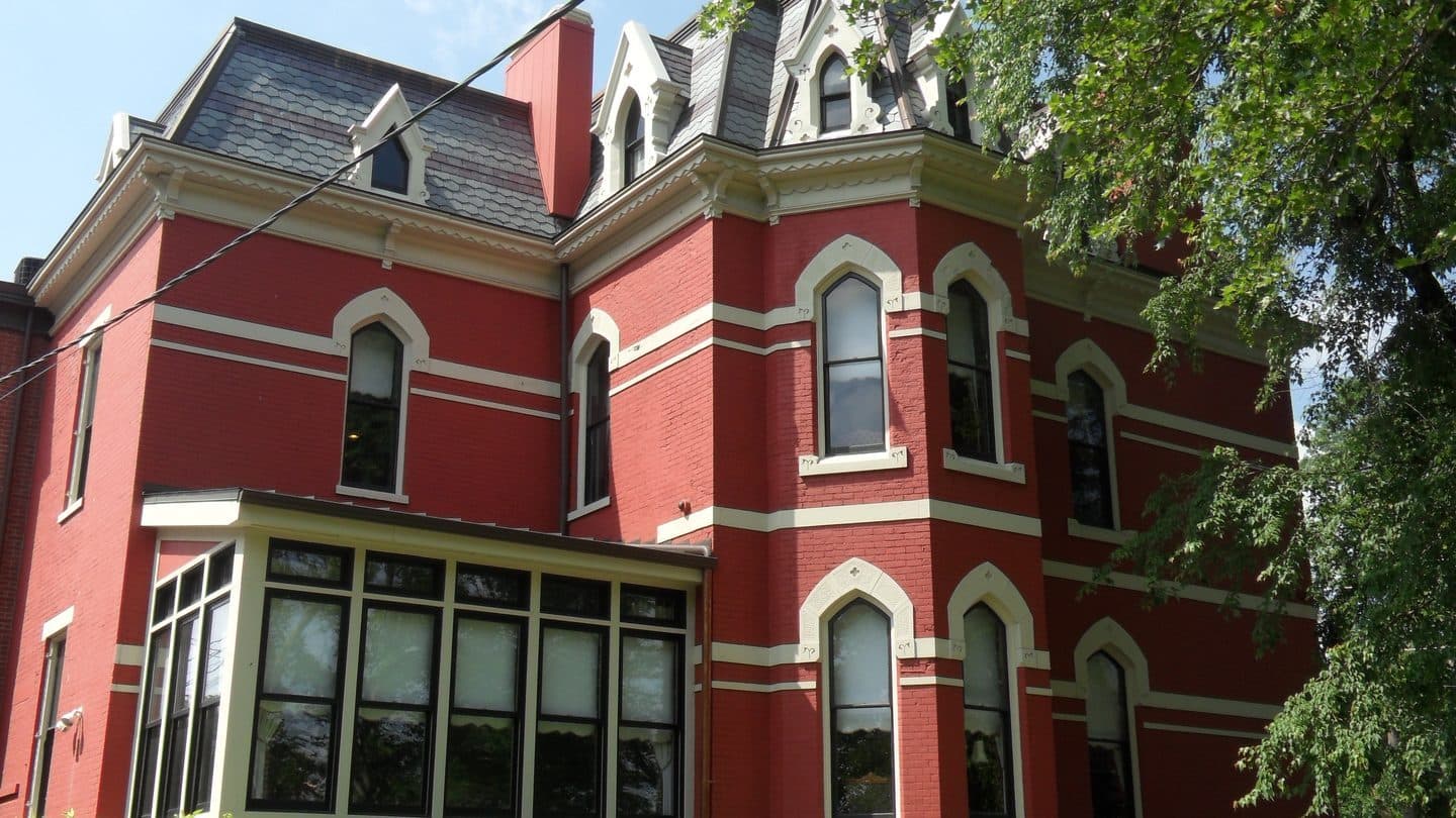 Enclosed porch addition on a house, extra living space that may not match the permit record